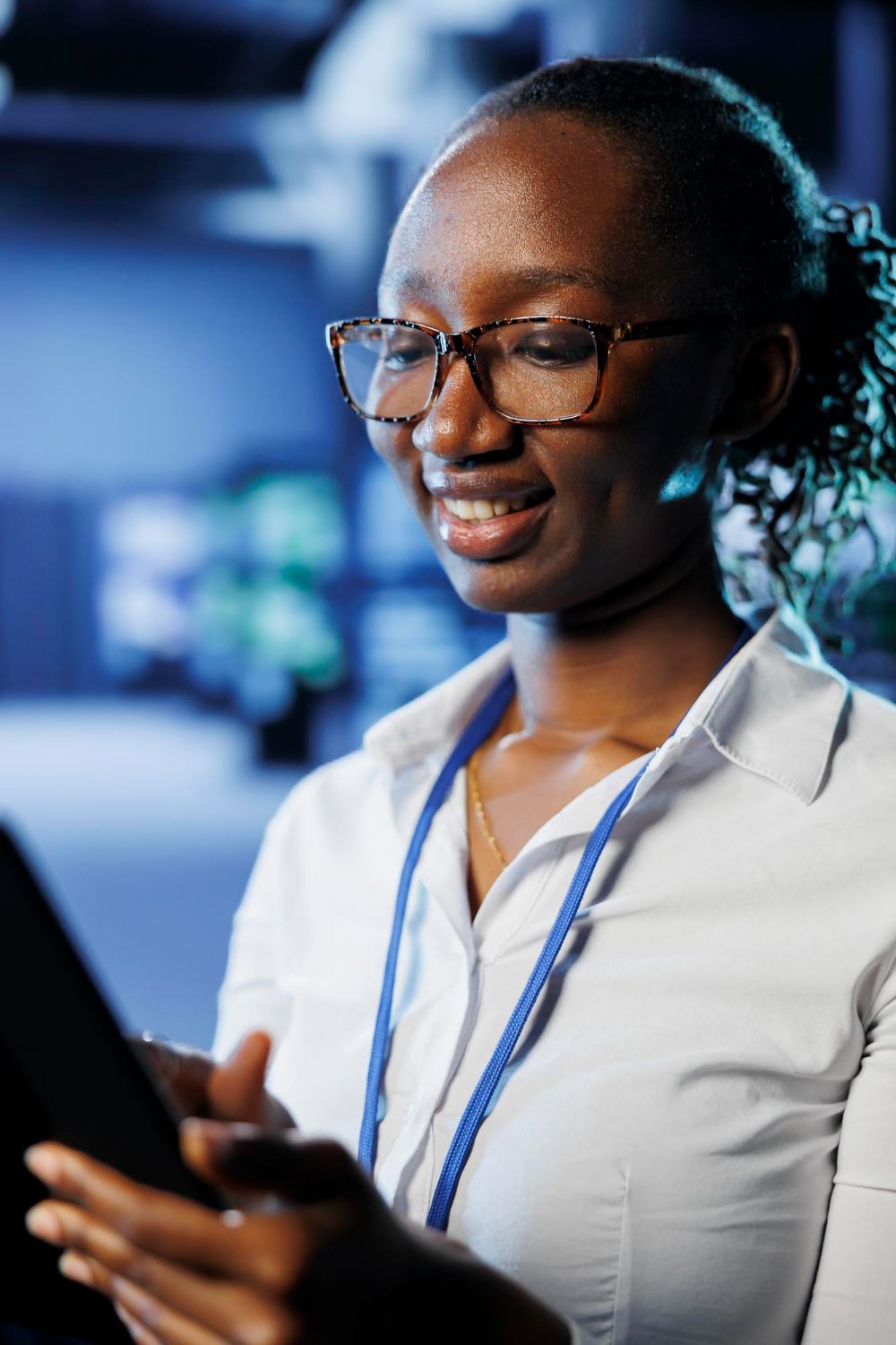 Ace engineer reviewing systems on a tablet in a data centre